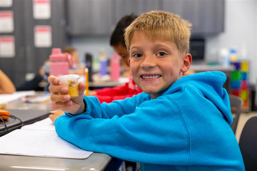 Students smile in science class